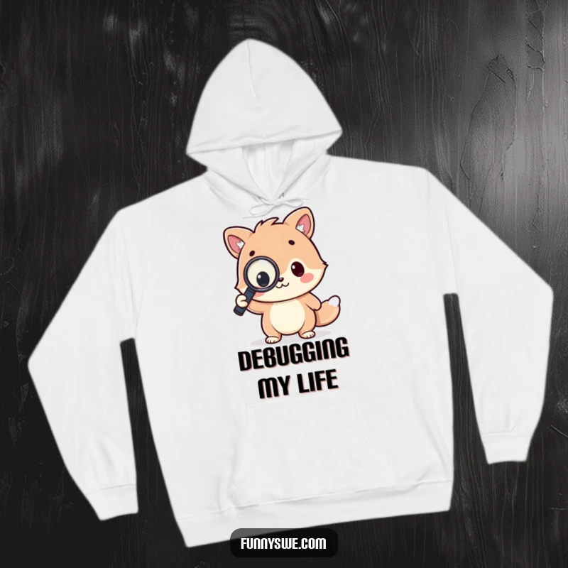 Funny hoodie with a kawaii animal character triumphantly examining a line of code with a magnifying glass, celebrating a debugging win.