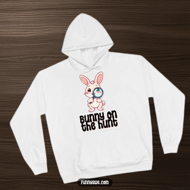Funny Hoodie featuring a bouncing bunny character holding a debugging magnifying glass, offering warmth and playful problem-solving humor.